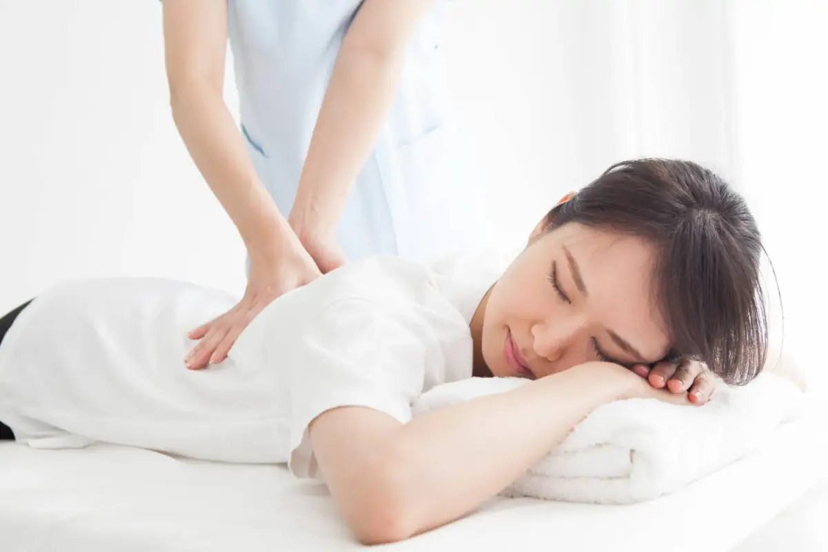 Patient resting on a treatment table after an adjustment